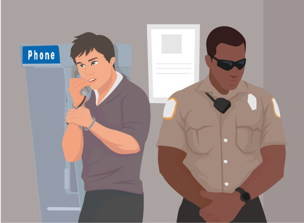 graphic of an inmate using the payphone